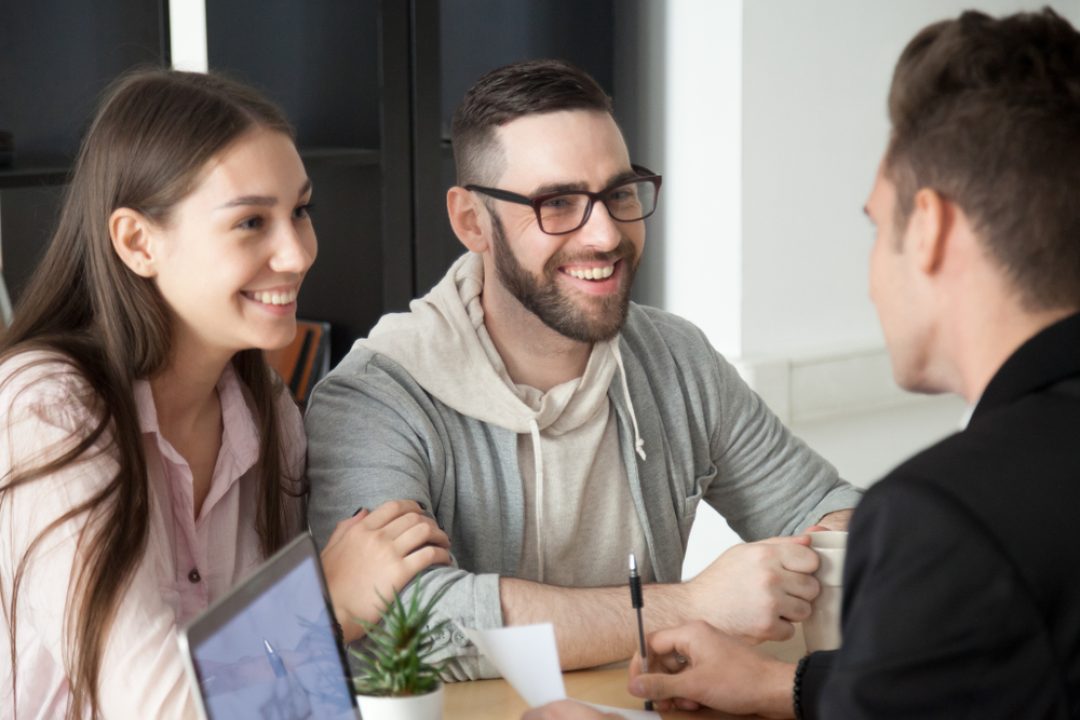 Excited,Smiling,Millennial,Couple,Discussing,Mortgage,Loan,Investment,Or,Real